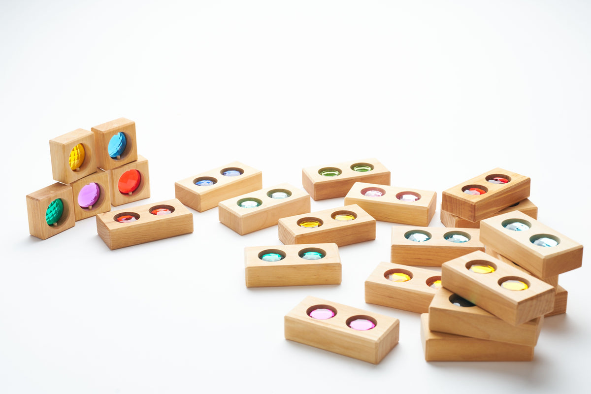 Bauspiel Colour Street blocks stacked and arranged for open-ended building play.