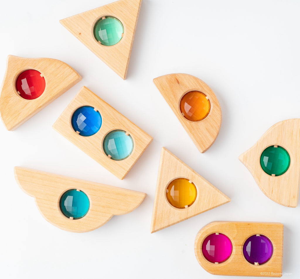 Natural wooden Bauspiel Fairytale Window Blocks in triangular, arched and rectangular shapes.