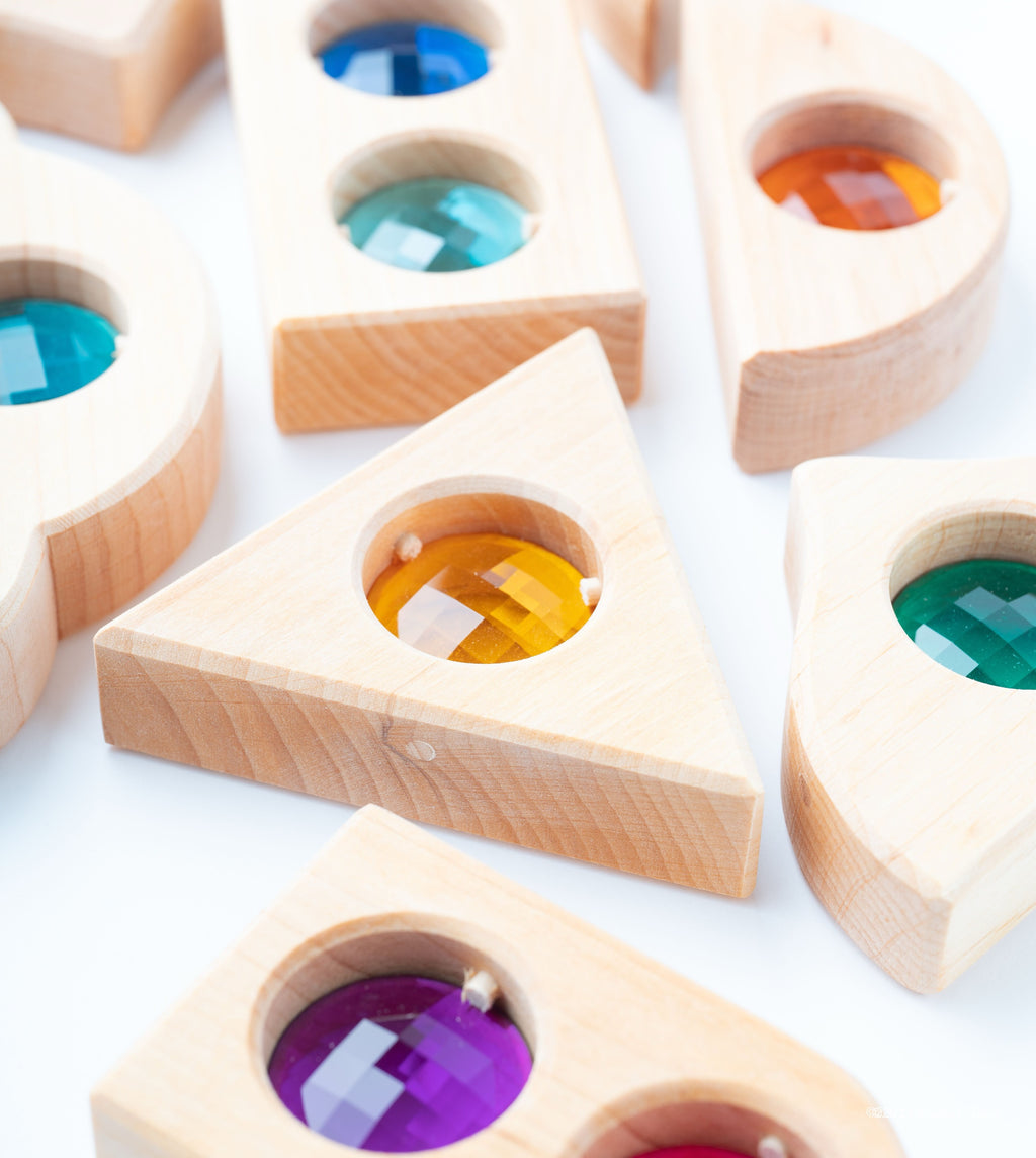 Close-up of the wood grain and coloured transparent inserts in Bauspiel Fairytale Window Blocks.