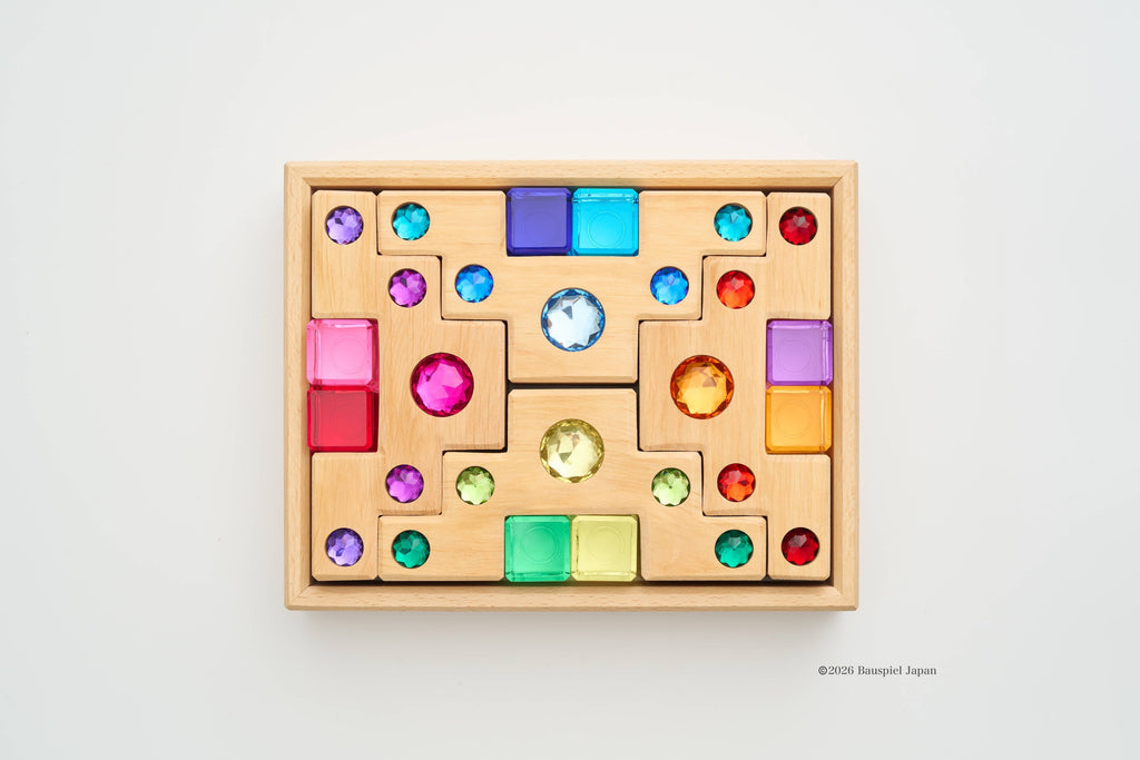 Bauspiel Small Colour Staircase & Light Blocks arranged in the wooden frame.