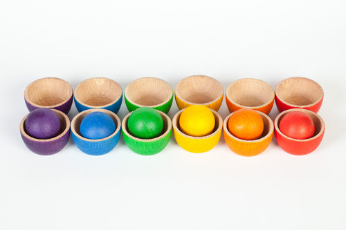 Grapat rainbow wooden bowls and balls arranged in two rows