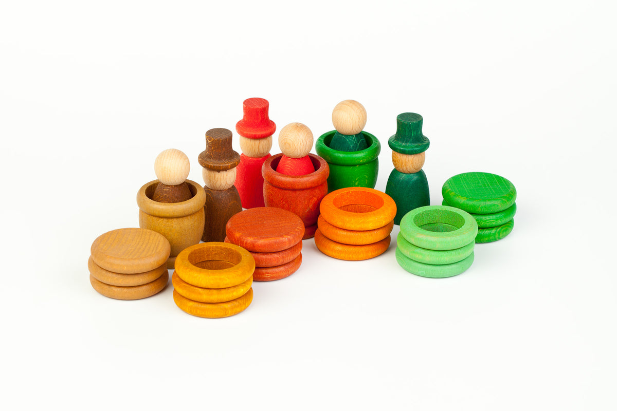 Grapat autumn-coloured figures, cups, rings and coins