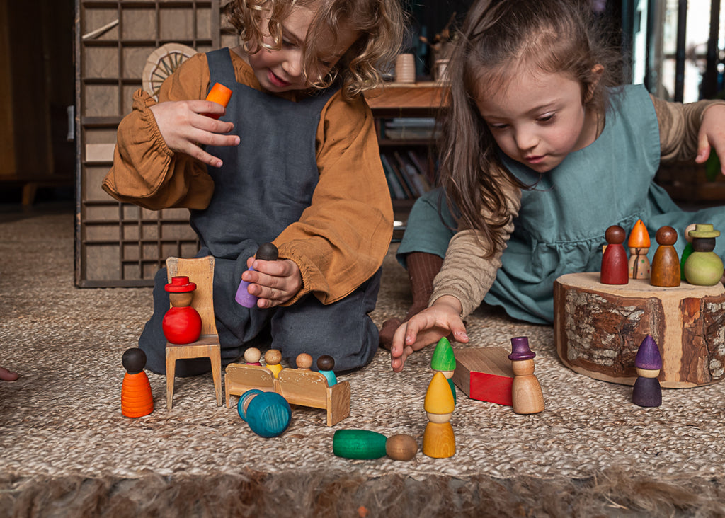 Children playing with Grapat Together figures and other toys