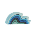 GRIMM’S Small Water Waves with six curved wooden pieces in shades of blue.